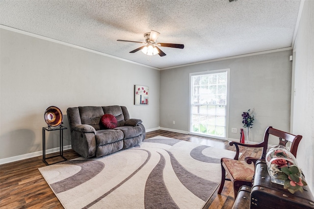 2614 Ivandell Ave, Dallas, TX 75211 - living room featuring wood finished floors, ornamental molding, ceiling fan, a textured ceiling, and baseboards