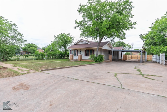 1810 Merchant St, Abilene, TX 79603 - view of front of home featuring concrete driveway and a detached carport