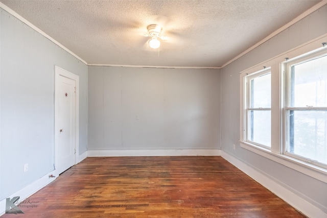 1810 Merchant St, Abilene, TX 79603 - unfurnished room with crown molding, a textured ceiling, wood finished floors, and baseboards