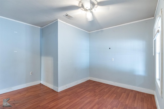 1810 Merchant St, Abilene, TX 79603 - spare room with a ceiling fan, ornamental molding, wood finished floors, and baseboards