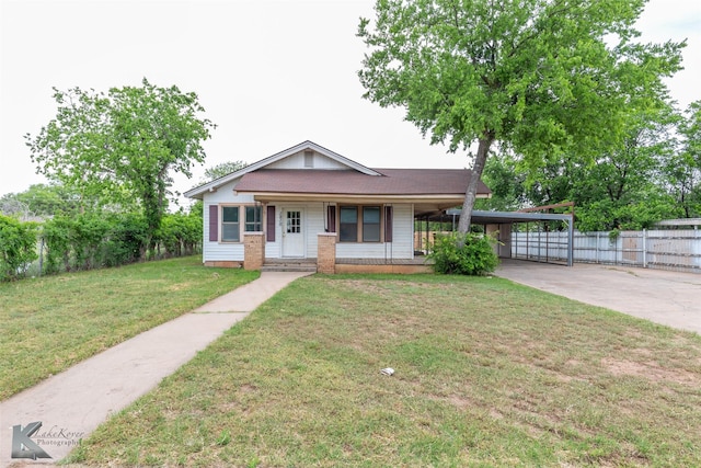 1810 Merchant St, Abilene, TX 79603 - view of front of property with driveway, covered porch, and a carport
