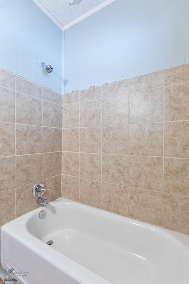 1810 Merchant St, Abilene, TX 79603 - bathroom featuring crown molding, shower / tub combination, and a textured ceiling