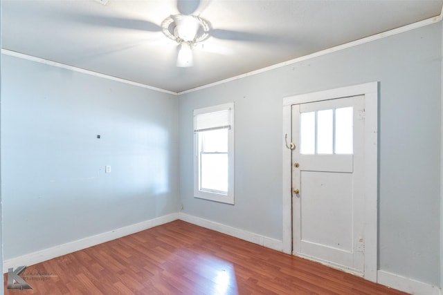 1810 Merchant St, Abilene, TX 79603 - foyer entrance with ornamental molding, wood finished floors, baseboards, and a ceiling fan