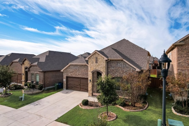 205 Mineral Point Dr, Aledo, TX 76008 - french country style house featuring brick siding, a garage, concrete driveway, and a front lawn