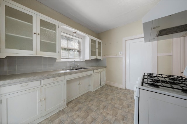 2701 Ethel Ave, Waco, TX 76707 - kitchen featuring white gas range oven, range hood, a sink, light countertops, and white cabinetry