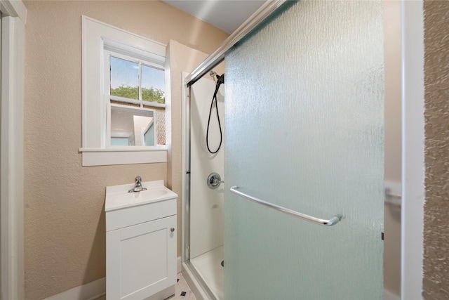 2701 Ethel Ave, Waco, TX 76707 - full bath with a shower stall, vanity, and a textured wall