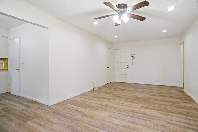 unfurnished room featuring recessed lighting, ceiling fan, light wood finished floors, and baseboards