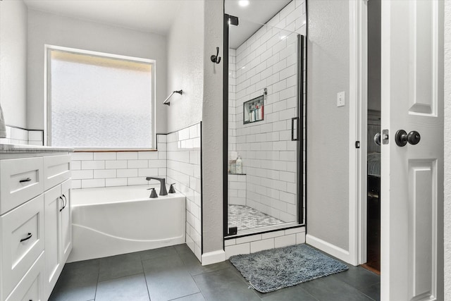 836 Heberle Dr, Burleson, TX 76028 - full bath with a stall shower, a garden tub, and tile patterned floors