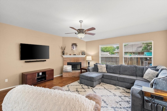 836 Heberle Dr, Burleson, TX 76028 - living area with wood finished floors, baseboards, ceiling fan, and a fireplace
