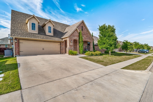 437 Sagebrush Dr, Aledo, TX 76008 - view of front of home with brick siding, driveway, roof with shingles, and an attached garage