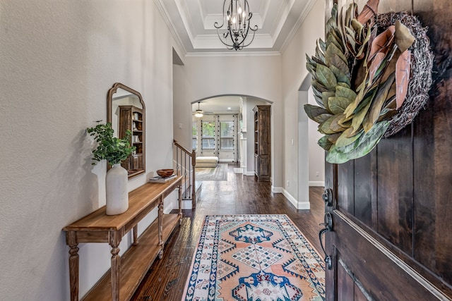 437 Sagebrush Dr, Aledo, TX 76008 - entrance foyer featuring arched walkways, crown molding, dark wood finished floors, a textured wall, and a chandelier