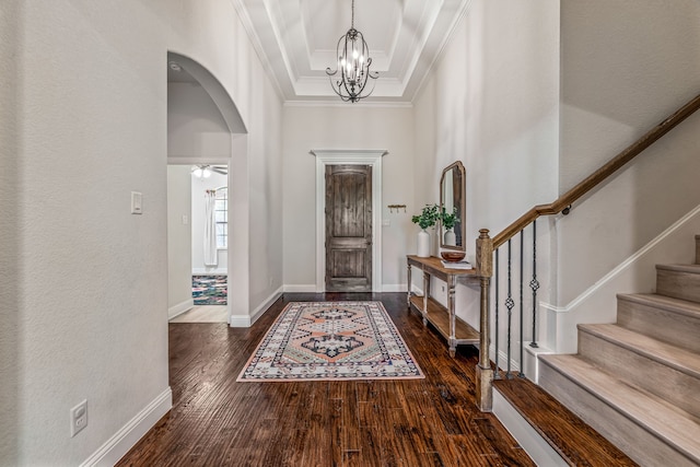 437 Sagebrush Dr, Aledo, TX 76008 - foyer entrance featuring arched walkways, crown molding, wood finished floors, a chandelier, and a towering ceiling