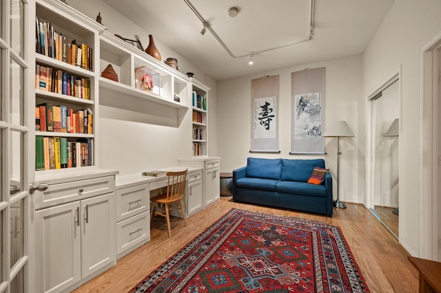 2305 Worthington St Unit 328, Dallas, TX 75204 - home office with built in study area, light wood-style floors, rail lighting, and attic access