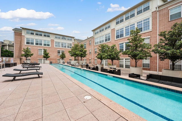 2305 Worthington St Unit 328, Dallas, TX 75204 - community pool featuring a patio and an outdoor hangout area