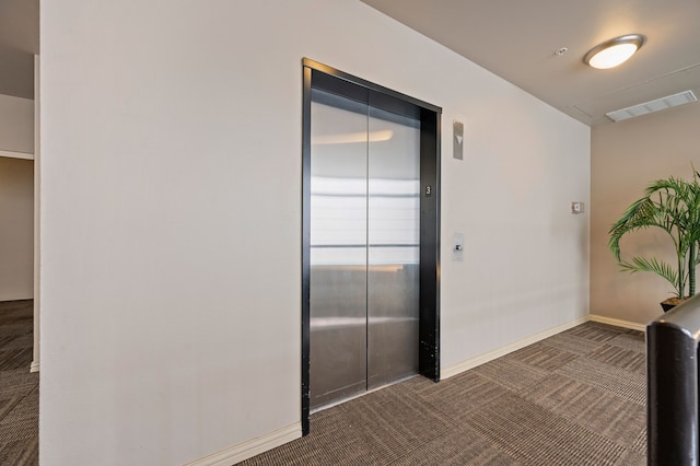 2305 Worthington St Unit 328, Dallas, TX 75204 - hall featuring elevator and dark colored carpet