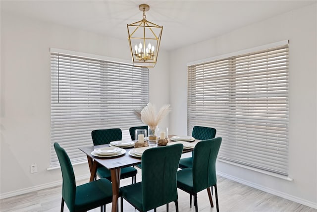 1427 Northridge Dr, Carrollton, TX 75006 - dining space with a chandelier, light wood-style flooring, and baseboards