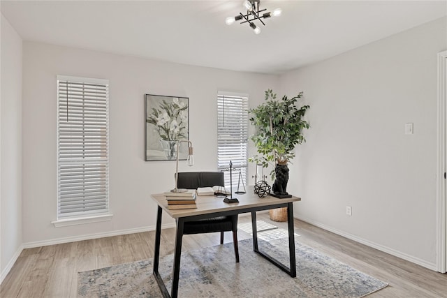1427 Northridge Dr, Carrollton, TX 75006 - office with light wood finished floors, a chandelier, and baseboards