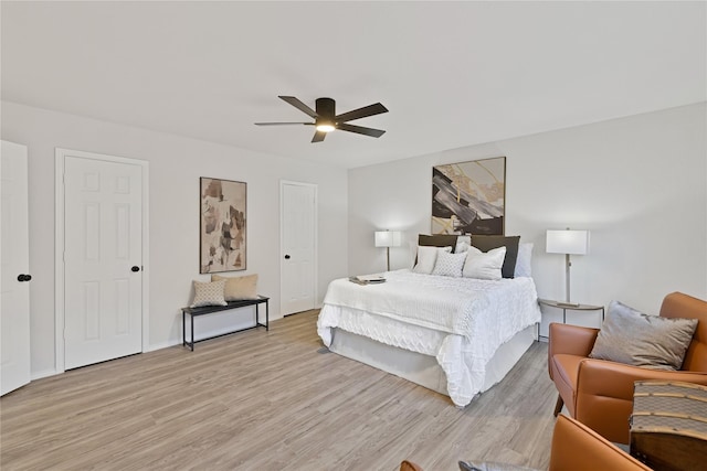 1427 Northridge Dr, Carrollton, TX 75006 - bedroom with light wood-style flooring, a ceiling fan, and baseboards