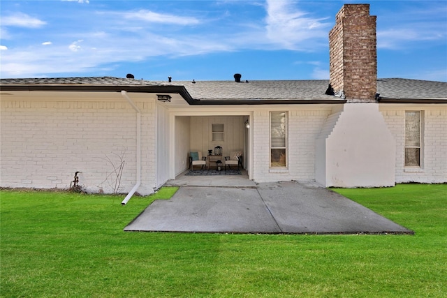 1427 Northridge Dr, Carrollton, TX 75006 - rear view of property featuring a chimney, brick siding, a patio area, and a yard
