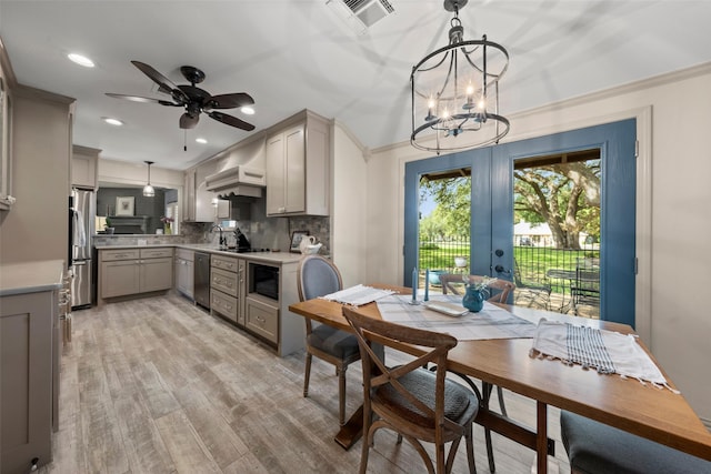 3417 Fern Hill Cir, Waco, TX 76708 - dining area featuring french doors, light wood-style floors, a chandelier, a ceiling fan, and recessed lighting