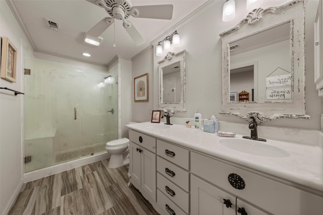 3417 Fern Hill Cir, Waco, TX 76708 - full bathroom featuring toilet, a stall shower, ceiling fan, double vanity, and crown molding
