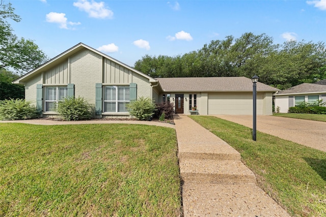 3417 Fern Hill Cir, Waco, TX 76708 - view of front of home featuring brick siding, concrete driveway, an attached garage, and a front lawn