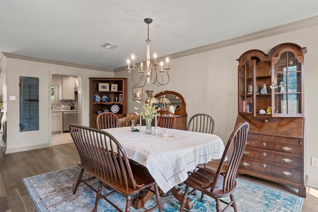 3417 Fern Hill Cir, Waco, TX 76708 - dining space with a chandelier, crown molding, wood finished floors, and baseboards
