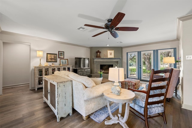 3417 Fern Hill Cir, Waco, TX 76708 - living area featuring ceiling fan, ornamental molding, baseboards, dark wood-style flooring, and a large fireplace