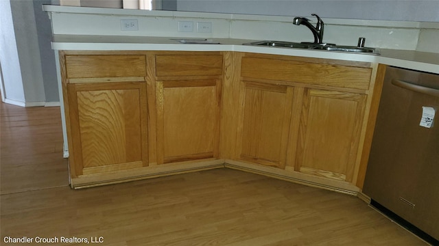 741 Cardinal Dr, Saginaw, TX 76131 - kitchen featuring stainless steel dishwasher, a sink, light wood finished floors, and light countertops
