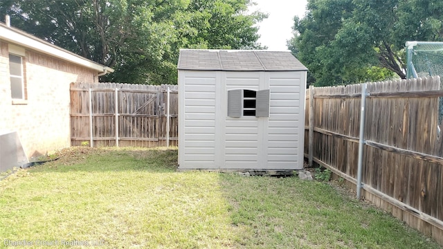 741 Cardinal Dr, Saginaw, TX 76131 - view of yard featuring a storage unit and an outdoor structure