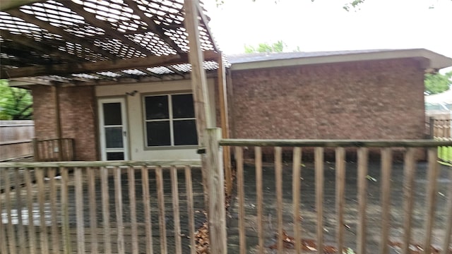 741 Cardinal Dr, Saginaw, TX 76131 - view of property exterior featuring a pergola, brick siding, and fence