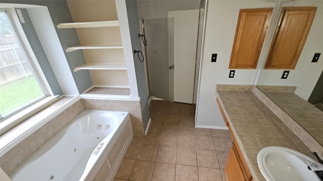 741 Cardinal Dr, Saginaw, TX 76131 - bathroom featuring a whirlpool tub, tile patterned floors, a walk in shower, vanity, and baseboards