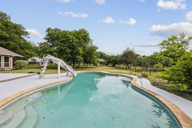 106 Morning Star Trl, Aurora, TX 76078 - outdoor pool featuring a water slide, a yard, a patio area, and view of wooded area