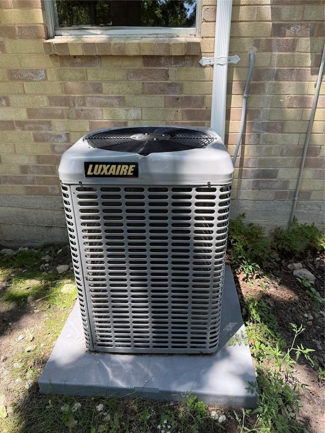 405 Forest Ln, Gun Barrel City, TX 75156 - exterior view of central AC unit and brick siding