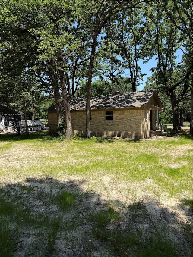 405 Forest Ln, Gun Barrel City, TX 75156 - view of side of property featuring an outbuilding and a chimney