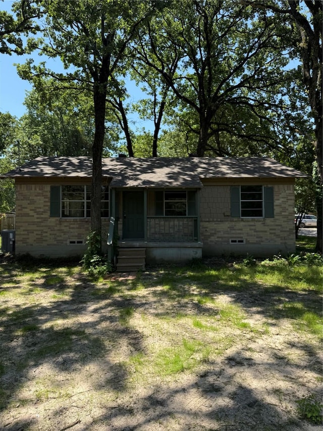 405 Forest Ln, Gun Barrel City, TX 75156 - view of front of home with covered porch and crawl space