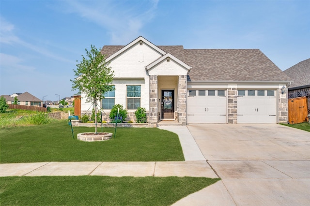 5616 Shannon Creek Rd, Fort Worth, TX 76126 - view of front facade with an attached garage, concrete driveway, roof with shingles, and stone siding