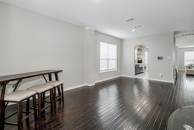 2420 Poplar Spring Rd, Fort Worth, TX 76123 - dining area with arched walkways, dark wood-style floors, baseboards, and recessed lighting