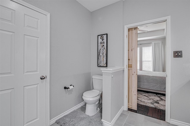 2420 Poplar Spring Rd, Fort Worth, TX 76123 - bathroom with toilet, tile patterned flooring, ensuite bath, and baseboards