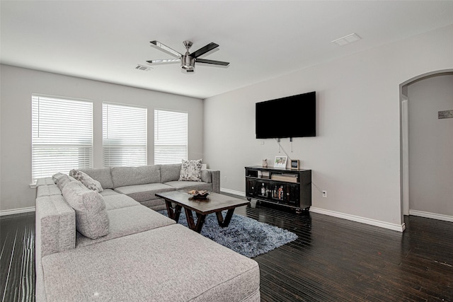 2420 Poplar Spring Rd, Fort Worth, TX 76123 - living room featuring arched walkways, ceiling fan, baseboards, and dark wood-style floors
