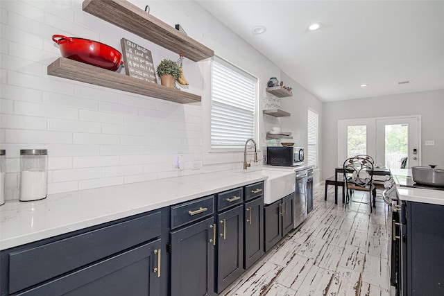 2420 Poplar Spring Rd, Fort Worth, TX 76123 - kitchen featuring open shelves, appliances with stainless steel finishes, a sink, tasteful backsplash, and recessed lighting