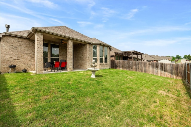 1714 Lone Lynx Way, Wylie, TX 75098 - back of property featuring a patio, ceiling fan, brick siding, and a shingled roof