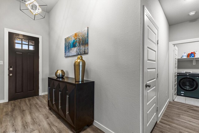 1714 Lone Lynx Way, Wylie, TX 75098 - foyer with washer / dryer, wood finished floors, and baseboards