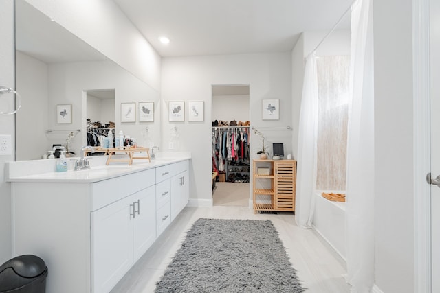 223 Quarry St, Melissa, TX 75454 - full bathroom featuring a bath, double vanity, a walk in closet, and recessed lighting
