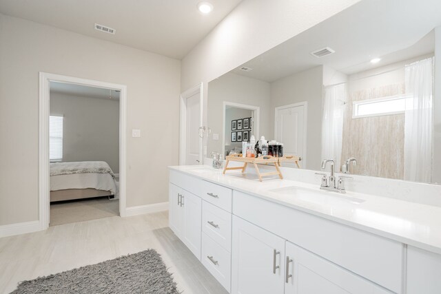 223 Quarry St, Melissa, TX 75454 - full bathroom with baseboards, recessed lighting, double vanity, a shower with shower curtain, and connected bathroom