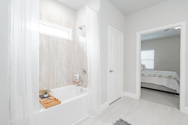 223 Quarry St, Melissa, TX 75454 - bathroom featuring shower / bath combo, ensuite bathroom, and baseboards