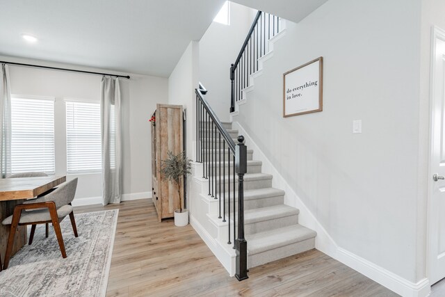 223 Quarry St, Melissa, TX 75454 - entrance foyer with light wood-style floors, stairway, and baseboards