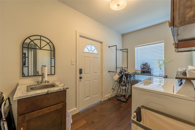 2025 Columbus Ave, Waco, TX 76701 - entrance foyer featuring washer and dryer and dark wood-style floors