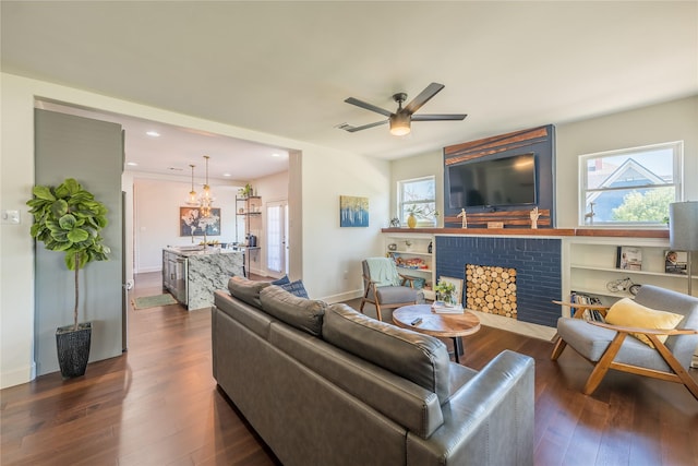 2025 Columbus Ave, Waco, TX 76701 - living room featuring a fireplace, dark wood-type flooring, ceiling fan, recessed lighting, and baseboards