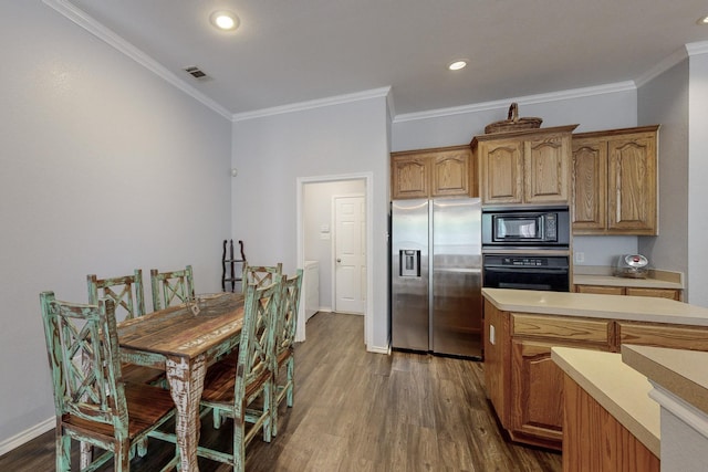 8614 Granville Dr, Dallas, TX 75249 - kitchen featuring black appliances, light countertops, dark wood-style floors, crown molding, and baseboards